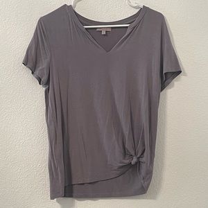 A grey float shirt with a tie-able bottom